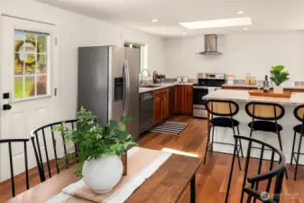Enjoy main level living with a large eat in kitchen with Canyon Creek solid cherry cabinets, stainless steel appliances and large island.