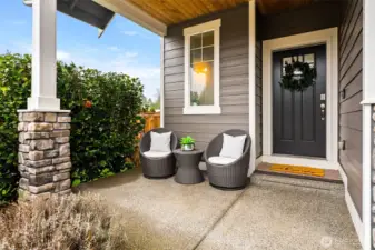 Charming, covered porch is very inviting.