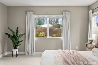 This primary suite is open and bright.  It feels like luxury and invites you to relax at the end of a long day or week.