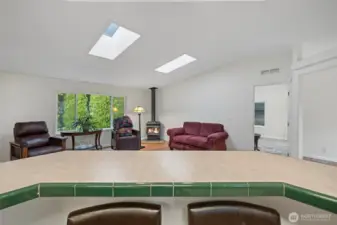 view into the living room from the bar in the kitchen