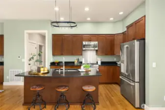 Spacious island kitchen offers plenty of space for cooks to share duties.