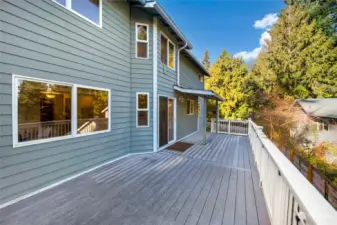 Oversized back deck is approx 12'x30', trex desking and a covered sitting area. Stairs off the north side to access the large yard.