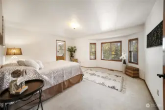 The master bedroom is approximately 15'x13' and features a bay window sitting area. It’s spacious enough to accommodate a king-sized bed and more.