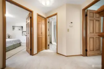 From the top of the stairs, this perspective shows the 2nd and 3rd bedrooms and the full upper bathroom.