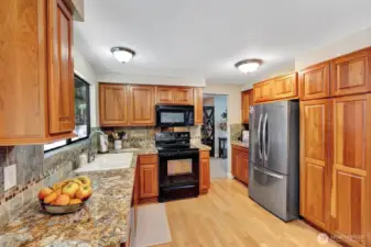 Warm and inviting Kitchen with beautiful cherry cabinets.
