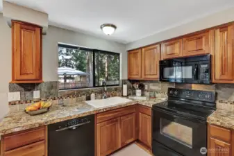 Kitchen with newer counter tops.
