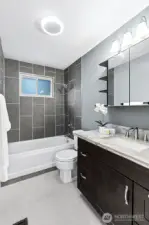 Updated lighting fresh paint and granite topped  vanity
