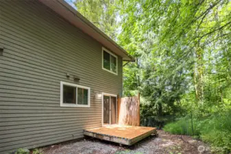 Backyard features a cozy deck and endless potential—ready for your personal touch and outdoor vision.
