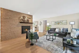 Once inside you are invited into the living room with gas fireplace, fresh paint and gorgeous flooring.