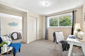 The office/den upstairs is open to the bedroom