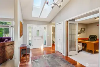 Light and bright foyer with skylights and windows.