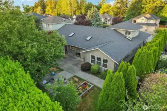 You can see how private the yard is, surrounded by mature trees and evergreen shrubs.