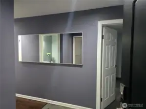 Beauty of an entry, Mirror stays, door enters primary bedroom