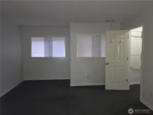 Primary bedroom with attached bathroom