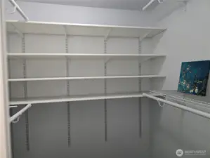 Walk in closet in primary bedroom