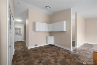 Another view from kitchen toward entryway, kitchen nook, and additional living space directly off kitchen peninsula. This kitchen nook can easily seat 6 or can be utilized as a hobby space, pantry build out, etc.