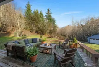 Enjoy the outdoors in complete privacy on your re-finished back deck! Deck provides views of your property, large open green space, green house, shop in distance. Tons of space for entertaining, gardening, and outdoor activities. Conveniently located directly off additional living space and kitchen.