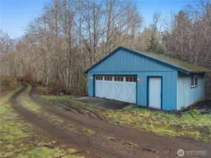 A short distance down the driveway lies your conveniently located shop! Utilize for extra parking, your toys, hobby shop, work space, home business, so many opportunities. Man door to right provides easy access to space.