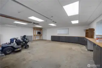 Interior view of huge shop! Notice built in  storage, electric, and the abundance of space for whatever you'd like to store.