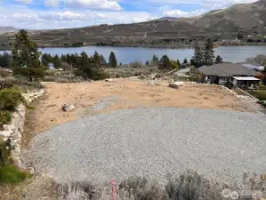 Flat lot, already retained, and ready for your home.