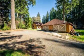 Detached shop building with the cabin.