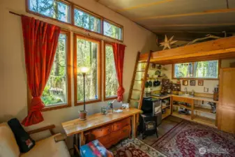 Studio interior: sitting area and kitchen