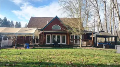 Gorgeous home with back deck plus there is a front side wrap around, covered porch!