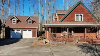 Two story home with 2 car garage and shop in the back.  Back deck with a hot tub that is covered and beautiful scenery!