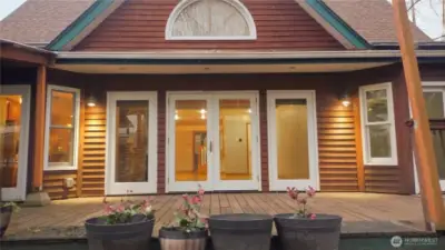 Back deck is almost the full length of the house.  Lots of windows in the living room which faces the east for those daily sunrises!