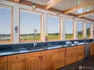 Soapstone counters and Shaker style cherry cabinets.