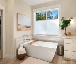 Soak your cares away in the freestanding tub with tile surround.