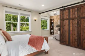 A barn door slides to reveal your vaulted sitting area.