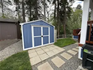 Power and patio work space with this shed.