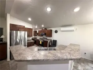 Lots of pull out drawers in kitchen.