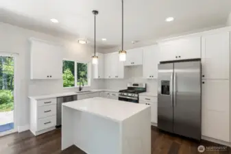 This island features striking waterfall edges, abundance of counter space and still room for casual dining.