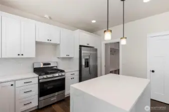 Stainless appliances.  Gas cooktop with griddle.  Microwave will be installed above the cooktop.