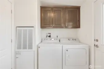 Off the kitchen is the laundry / utility room with outdoor access.