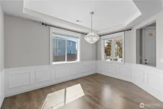 Dining Room with Fine Touches Such as Wainscoting and a Beautiful Chandelier Will Be Sure to Dazzle Your Guests.