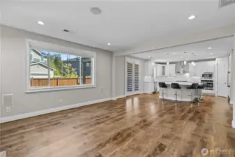 Spacious Living Room, Kitchen and Extra Tall Double-Doors Open to the Backyard Patio, Inviting the Inside Out. Open Concept Living at its Best!