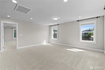 Family Room Features a Large Wall Space for a Big Screen. Cozy up with the Family for Movie Nights.