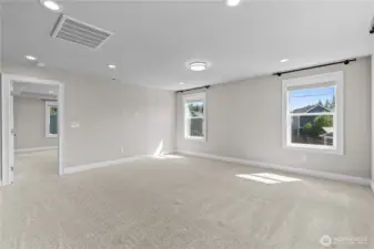 Family Room Features a Large Wall Space for a Big Screen. Cozy up with the Family for Movie Nights.