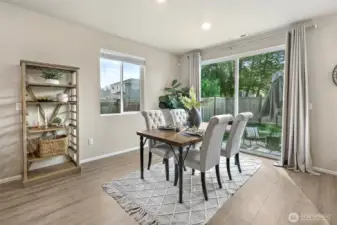 Open concept living and dining area with lots of natural light