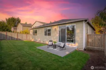 Spacious fenced backyard with patio