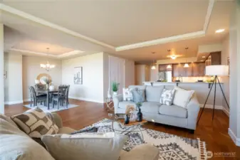 A rare distinction in this building, the formal dining room brings elevated elegance to an open-concept design—where tray ceilings, crown molding, and sweeping views enrich every moment. The generous pantry adds both function and finesse, thoughtfully designed to meet every culinary need.