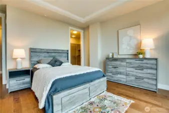Freshly painted and quietly tucked away, this serene primary features elegant crown molding and ample room for a reading chair, dresser, or a personalized retreat.