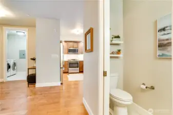 As we make our way back toward the foyer, take a moment to explore the bright and multifunctional utility/laundry room—conveniently located just to the left of the front entry. This thoughtfully designed space blends style and practicality, setting the tone for the refined functionality found throughout the home.