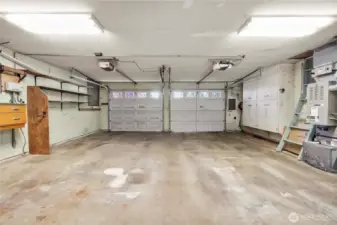 Large 2 car garage with storage on the sides