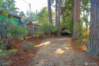 Backyard has access from the street for extra parking or possible future develpment