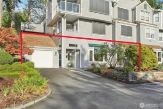 Corner Lower Unit with HUGE driveway and attached garage with storage