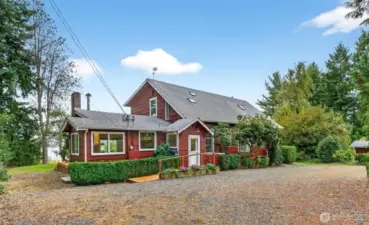 4403...Front view of the larger home that featuring 2 bedrooms, library with French Doors, spacious formal rooms, kitchen/family area and den plus water, Black Hills, sunsets and boat traffic views from most rooms.